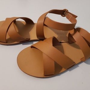 Tan criss-cross sandals